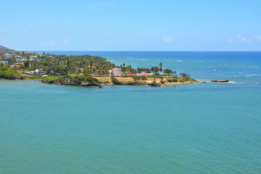 Aerial view of turquoise water and green headland in Puerto Plata